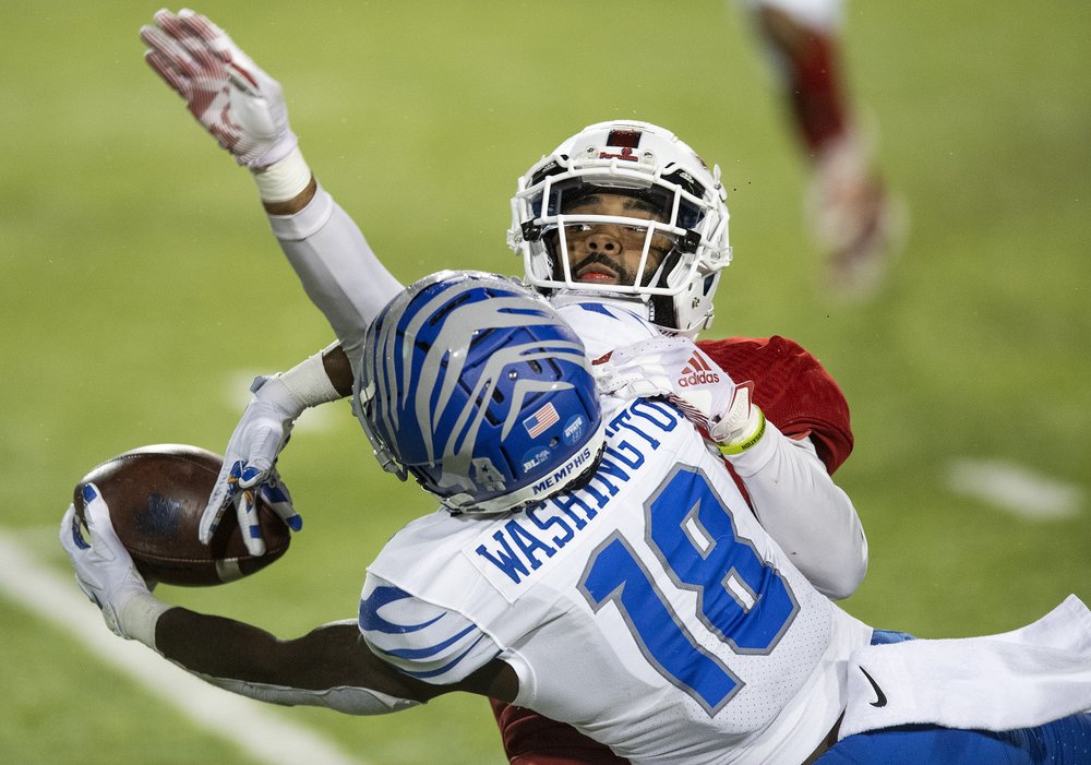 Memphis Tigers receiver Tahj Washington catches ball over FAU Owls cornerback Diashun Moss in 2020 Montgomery Bowl