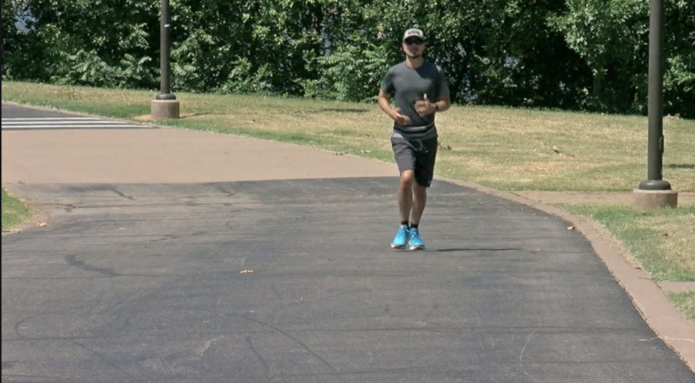 Jogger running along River Parks trail 