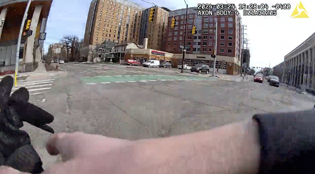 Officers raced on foot from the Ann Arbor Police Department to save the life of a man who was trying to break up an altercation and was shot