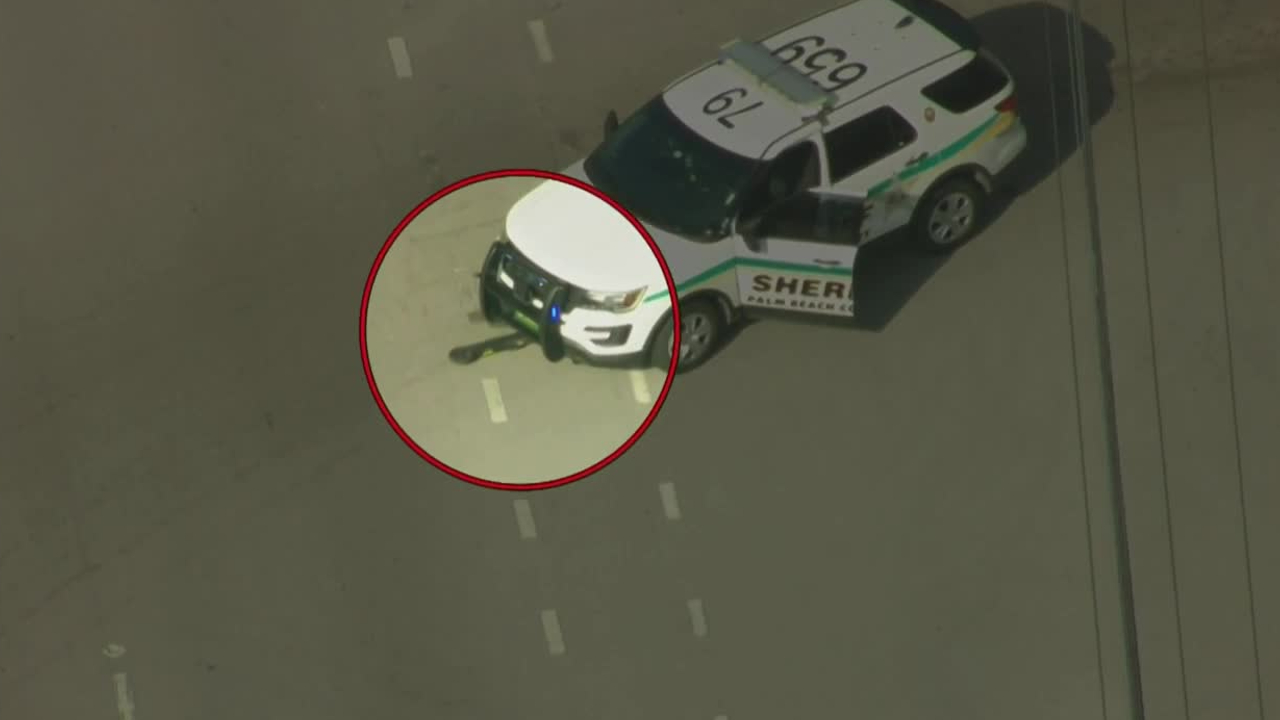 A scooter underneath a Palm Beach County Sheriff's Office SUV at South Shore Boulevard and Polo Gardens Drive in Wellington on March 6, 2023.jpg