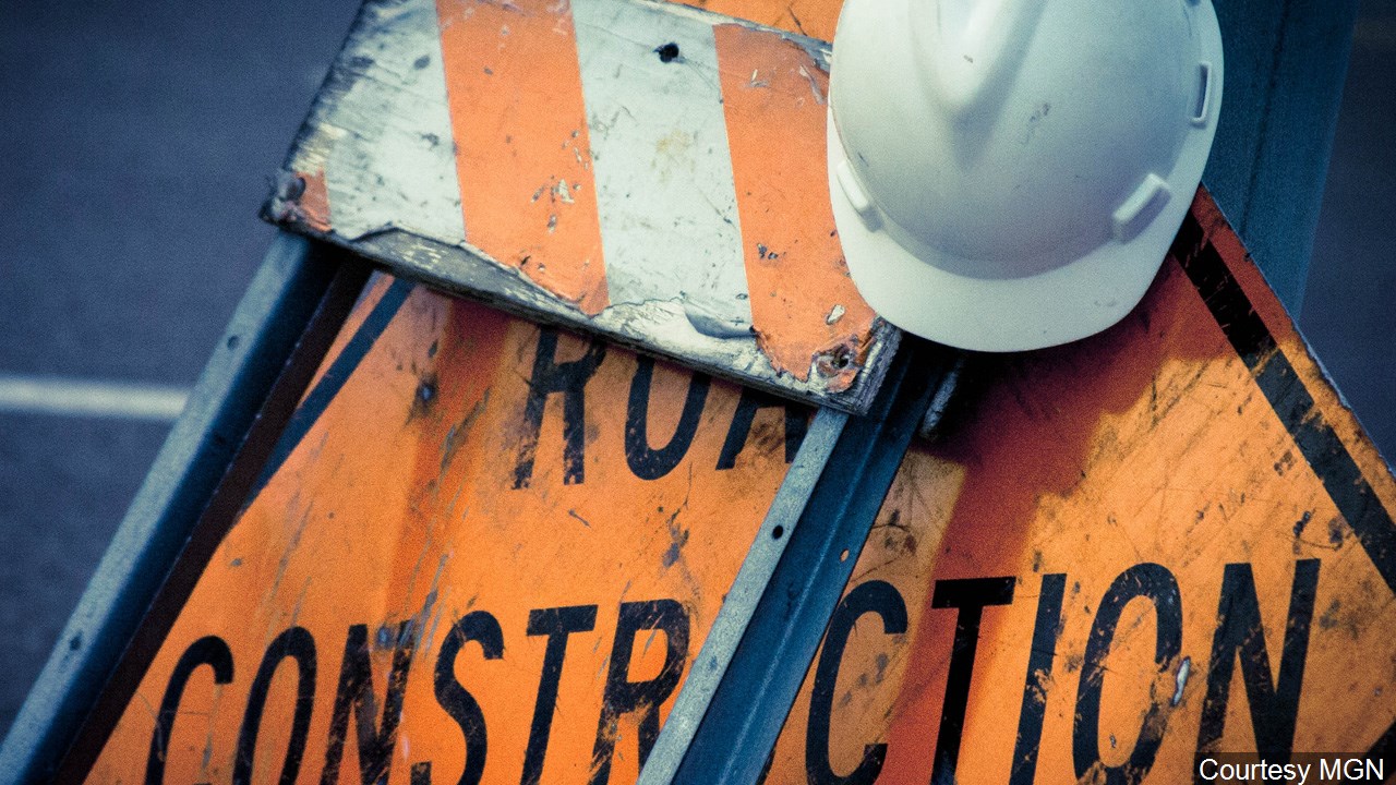 Workers remove barricades along the north side of SPID from Staples to Nile - Vimarsana News
