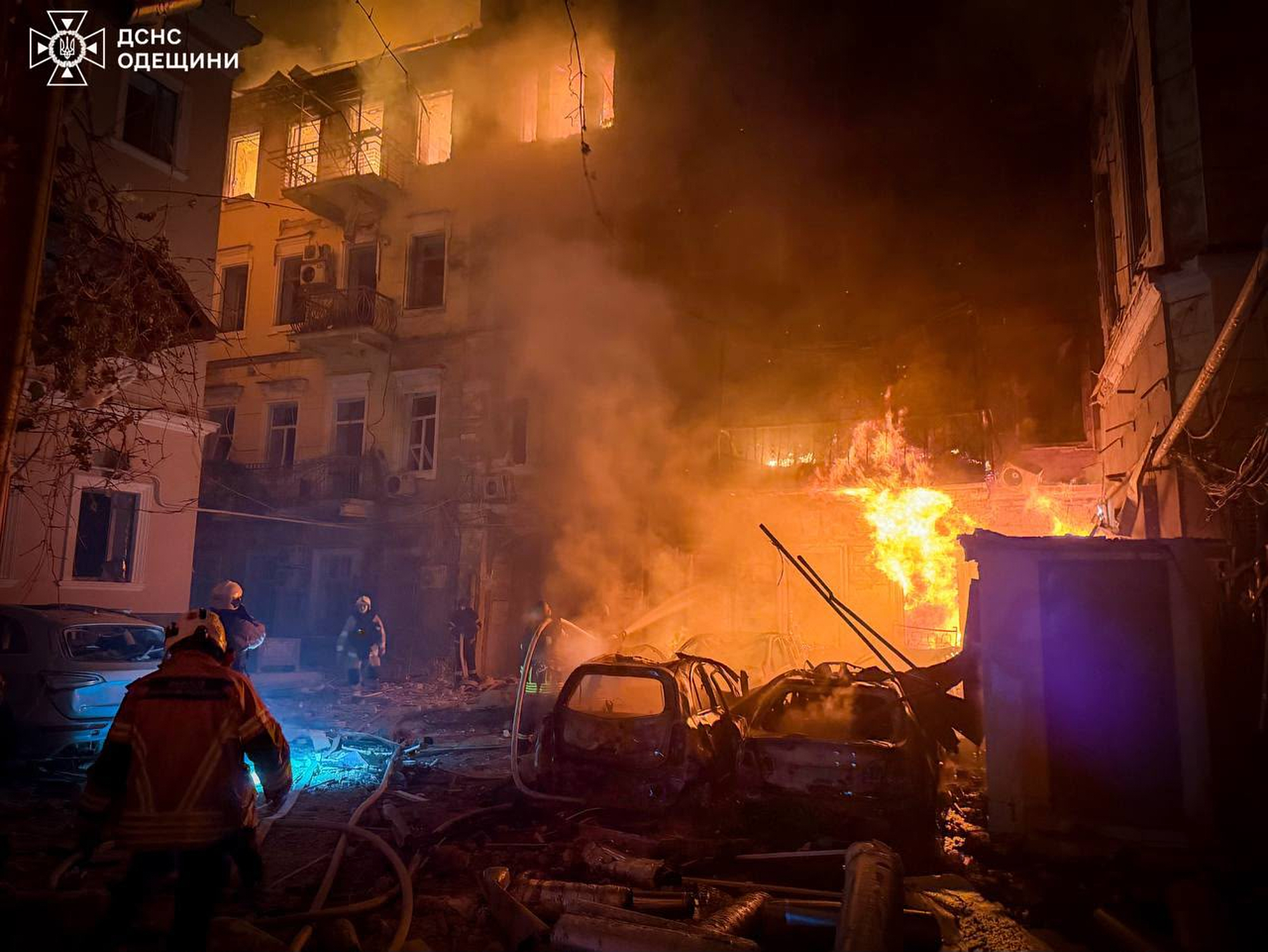 In this photo provided by the Ukrainian Emergency Service, emergency services personnel work to extinguish a fire of residential buildings following a Russian missiles attack in Odesa, Ukraine, Sunday, Aug. 9, 2026.