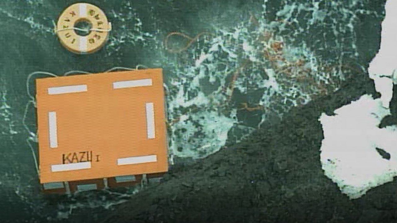Coast guard picture of a square-shaped lifesaving float with the name of a missing tour boat on it