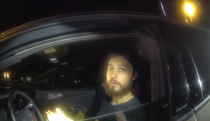 A police officer pulls over Jonathan Rinderknecht. 