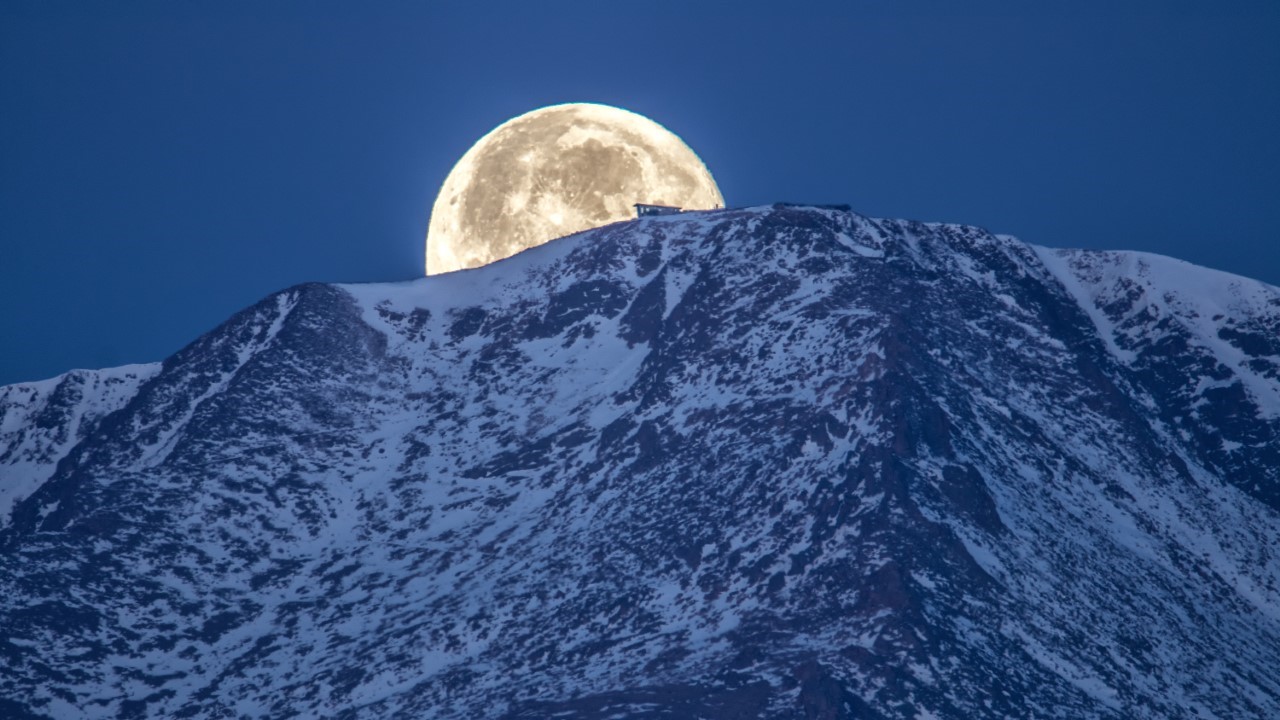 Moon setting behind Pikes Peak