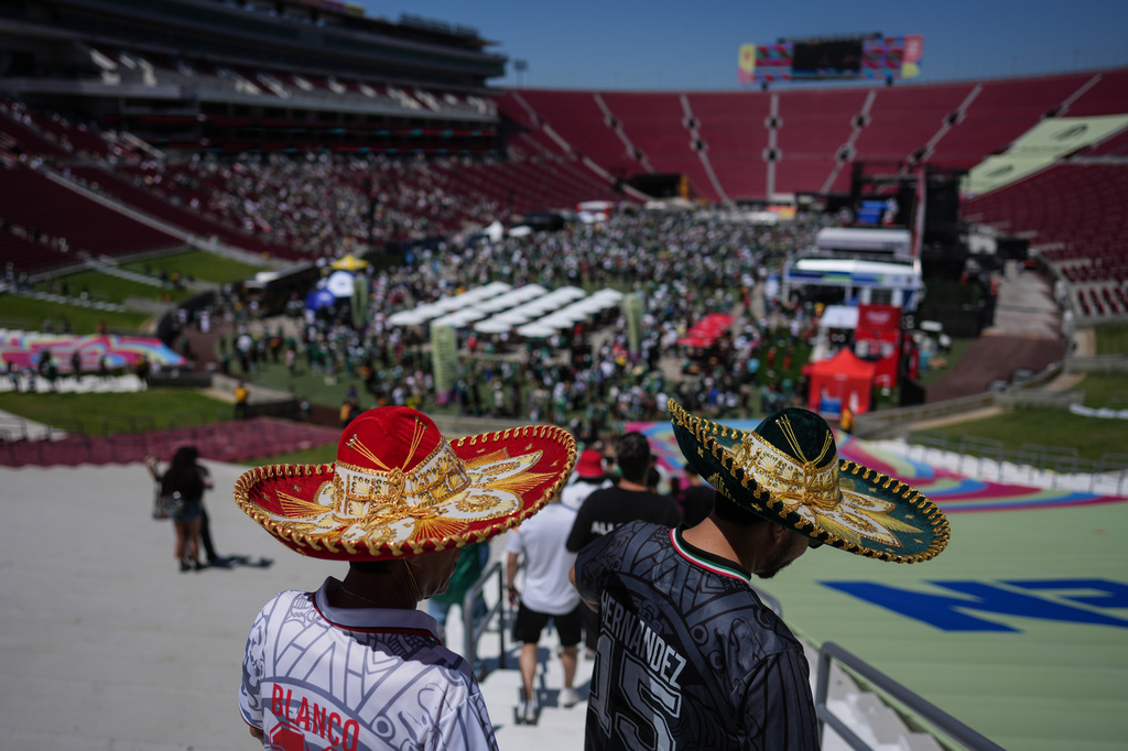 Fans arrive at a fan festival at the Los Angeles Memorial Coliseum in Los Angeles, Thursday, June 11, 2026, to watch a broadcast of the World Cup soccer match between Mexico and South Africa.