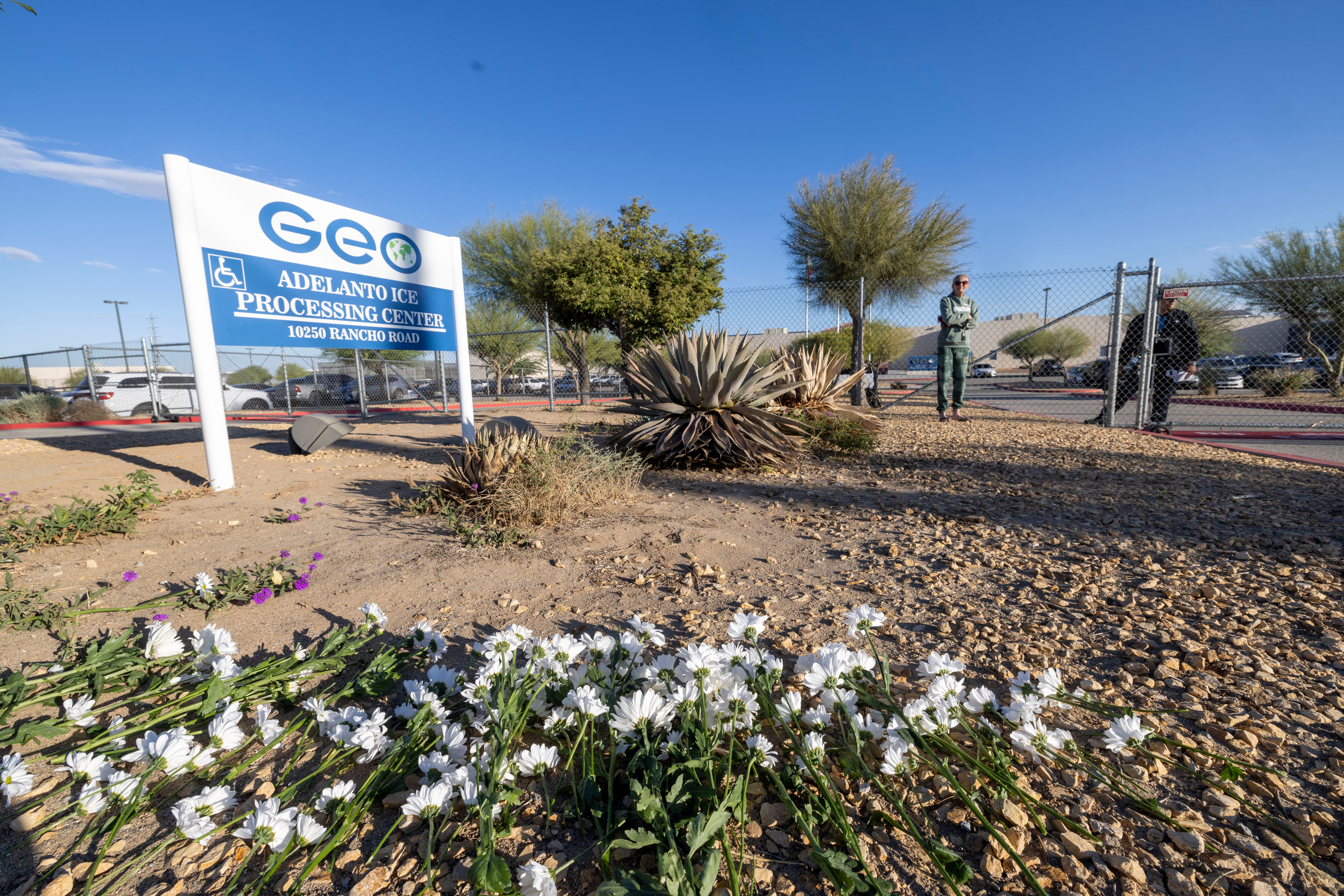 Flowers placed by demonstrators sit outside the Adelanto Ice Processing Center in Adelanto, Calif., on Tuesday, Sept. 29, 2026.