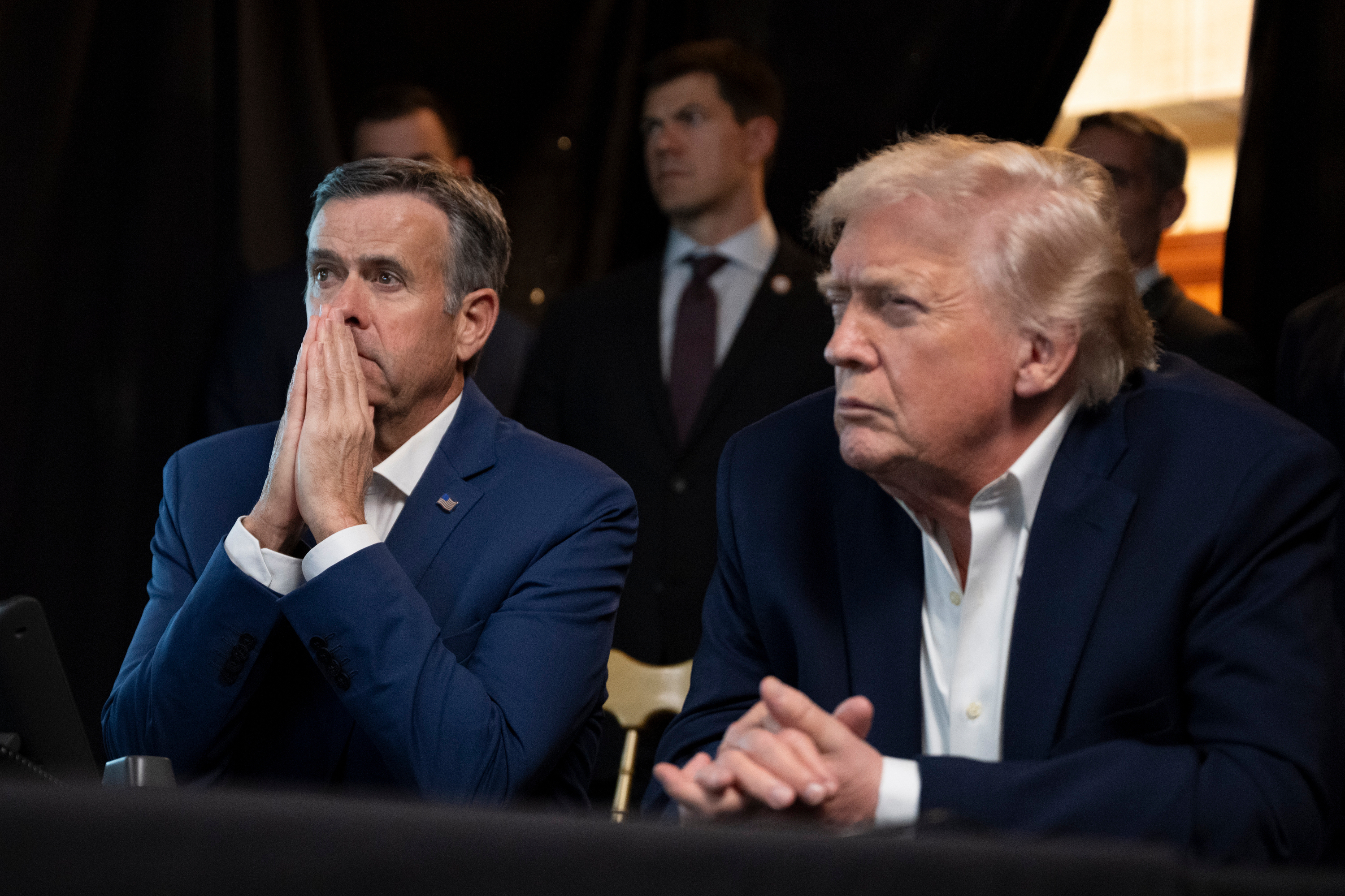 In this photo released by the White House, President Donald Trump monitors U.S. military operations in Venezuela, with CIA Director John Ratcliffe, left, at Mar-a-Lago in Palm Beach, Fla., Saturday, Jan. 3, 2026. 