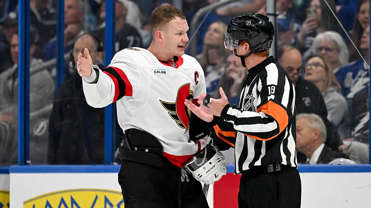 FILE - Ottawa Senators left wing Brady Tkachuk (7) talks to referee Tom Chmielewski (18) during the second period of an NHL hockey game against the Tampa Bay Lightning, March 28, 2026, in Tampa, Fla.