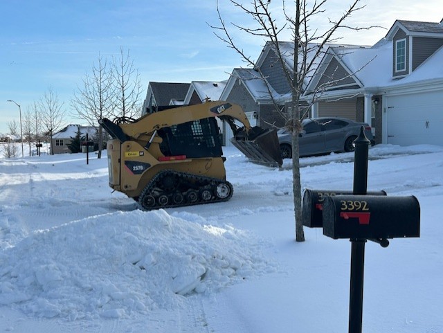 landscapers clearing snow