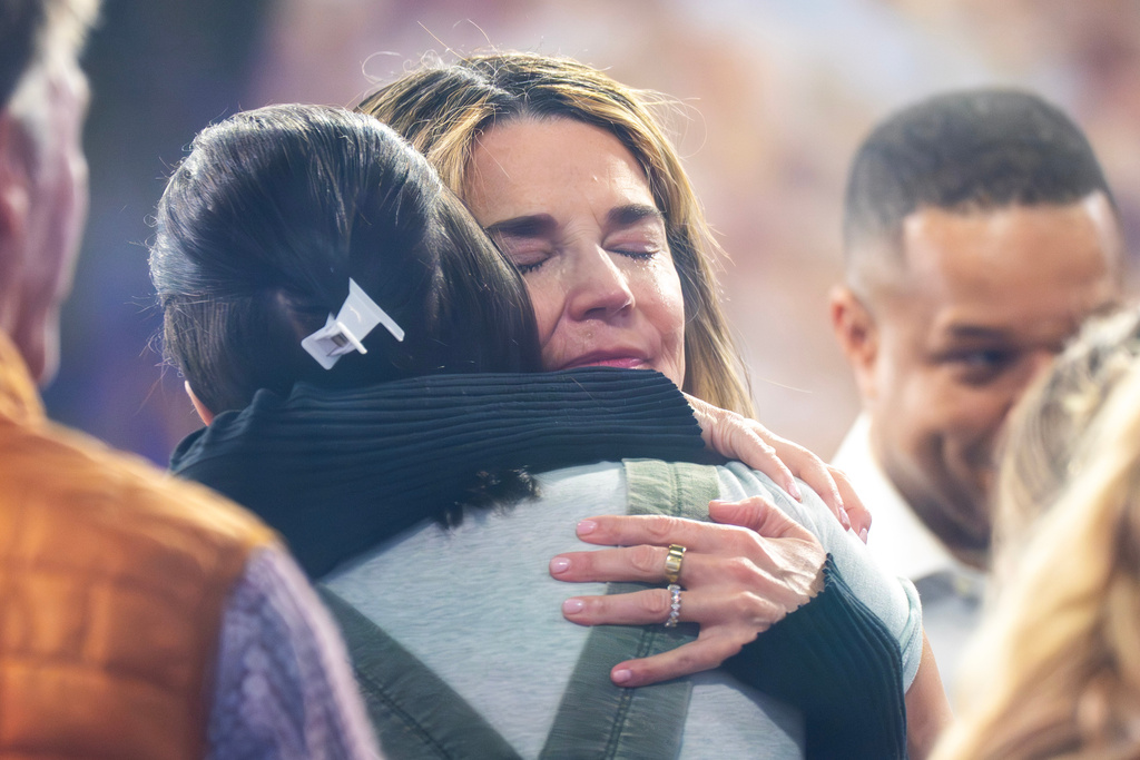 Savannah Guthrie hugs a staff member during a visit to the Today show at Rockefeller Plaza on Thursday, March 5, 2026, in New York. 