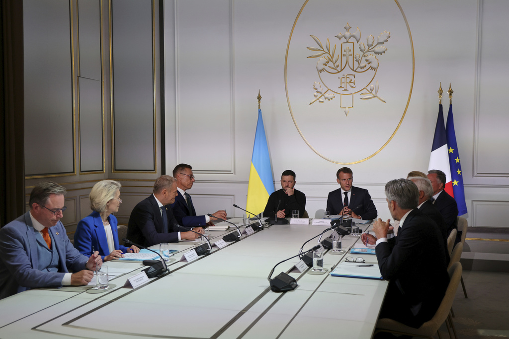 From left, Belgium's Prime Minister Bart De Wever, European Commission President Ursula von der Leyen, Poland's Prime Minister Donald Tusk, Finland's President Alexander Stubb, Ukraine's President Volodymyr Zelenskyy and French President Emmanuel Macron speak during a summit on Ukraine at the Elysee Palace, in Paris.