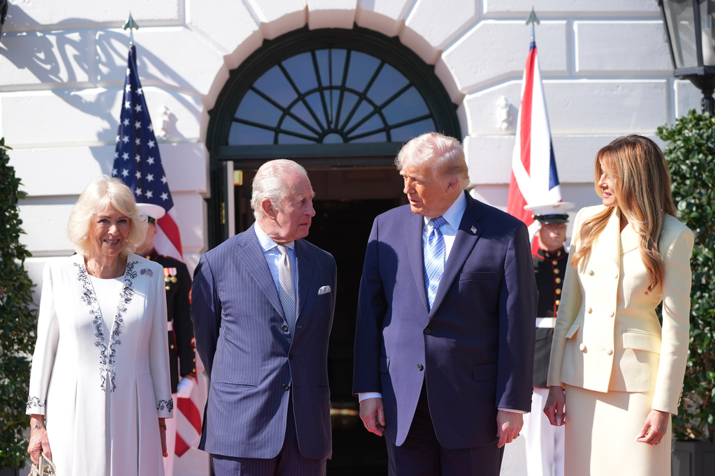 President Donald Trump and first lady Melania Trump greet King Charles III and Queen Camilla as they arrive at the White House, Monday, April 27, 2026, in Washington.