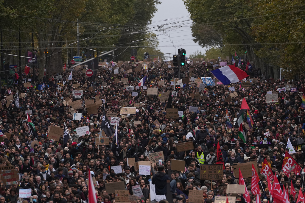 Protesters march during a demonstration against rising living costs in Paris, Saturday, Oct. 24, 2026.