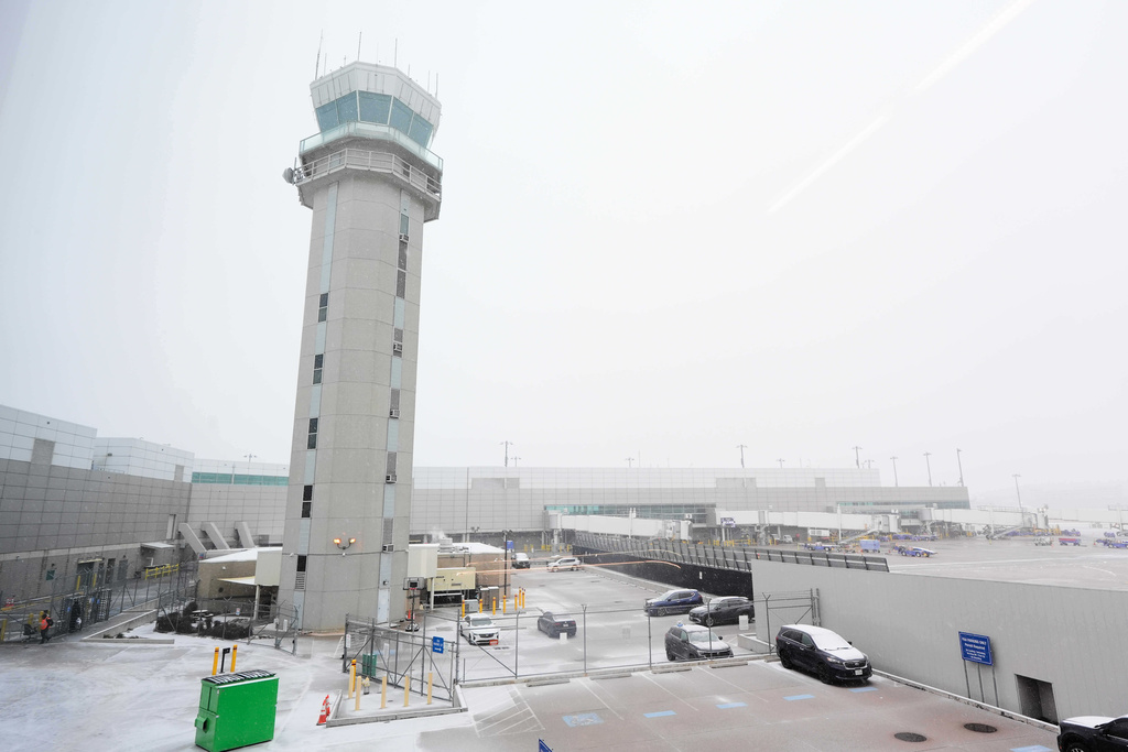 The control tower at Love Field Airport is shown where weather conditions have had an impact on travel in and out of the normally busy airport Saturday, Jan. 24, 2026, in Dallas.