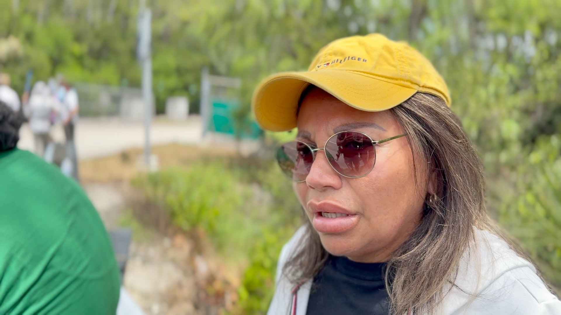 Benita Mendoza speaks to reporters.