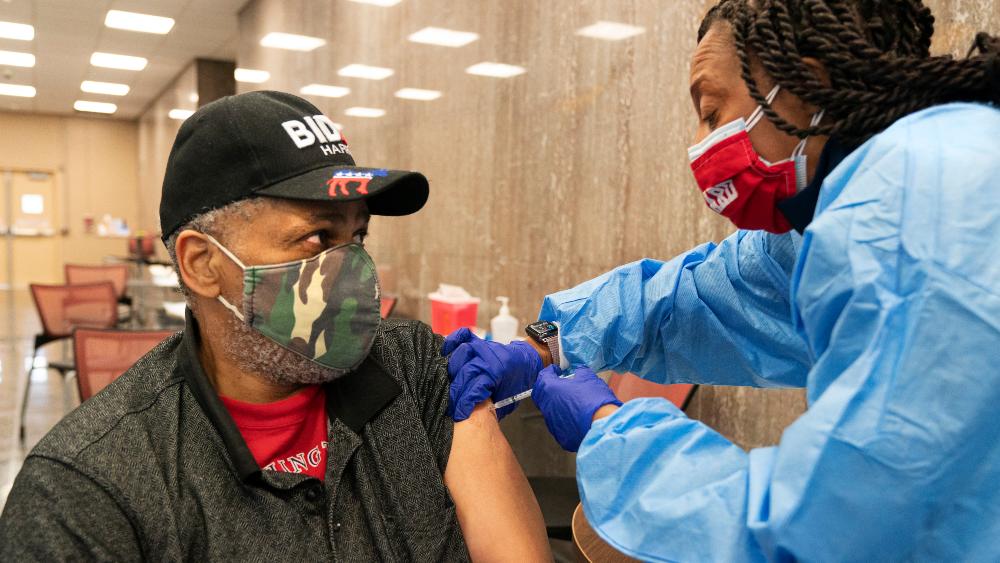 Black-man-getting-COVID-19-vaccine.png