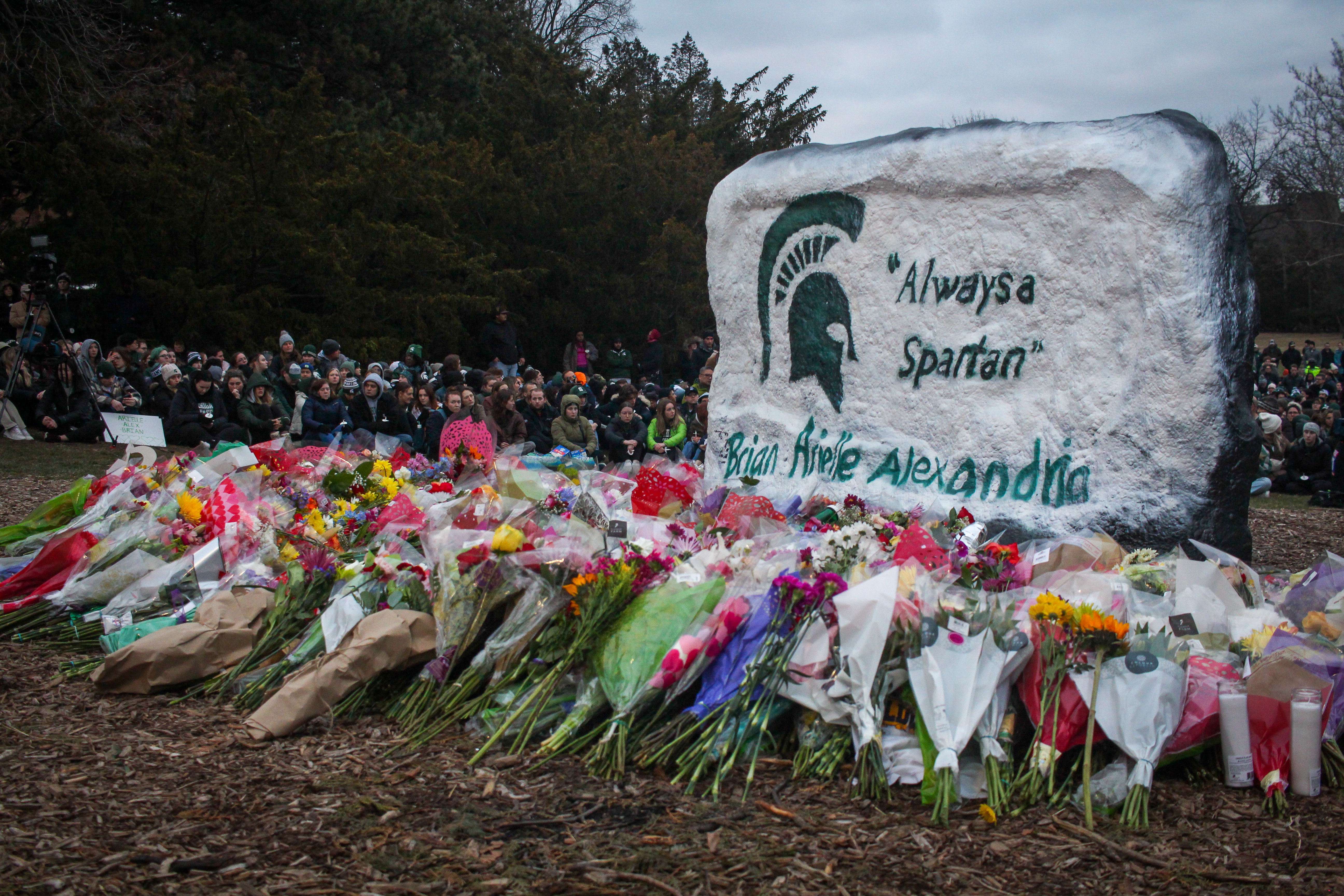 The MSU Rock reads "Always a Spartan" in memory of the three students killed after a mass shooting