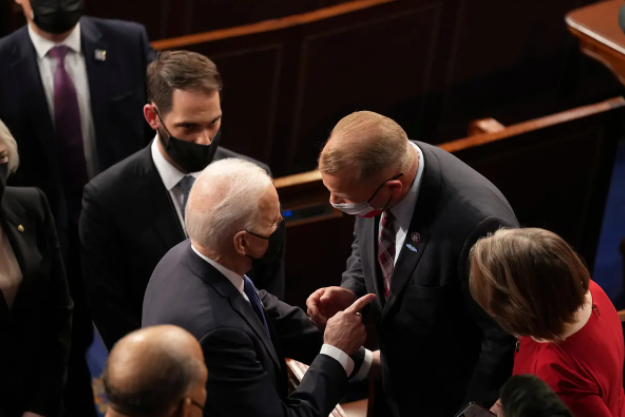 U.S. President Joe Biden briefly spoke with U.S. Rep. Troy Nehls, R-Texas, after delivering an address to a joint session of Congress in the House chamber of the U.S. Capitol in Washington D.C., on April 28, 2021