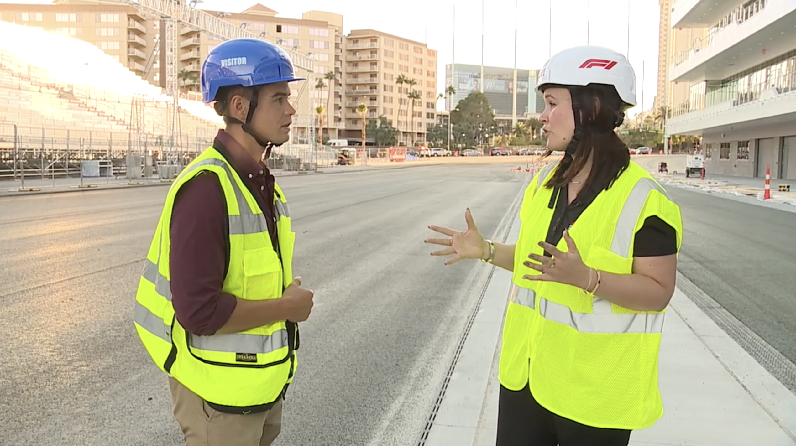 Joe Moeller talks with Silvia Betto at the F1 pit building