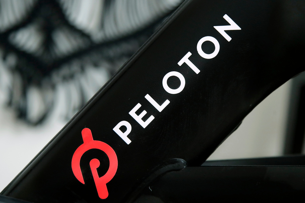 The Peloton logo is seen on the company's stationary bicycle in San Francisco, Calif., Nov. 19, 2019. 