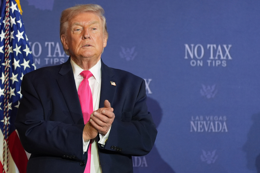 President Donald Trump stands on stage at a roundtable event about no tax on tips, Thursday, April 16, 2026, in Las Vegas.