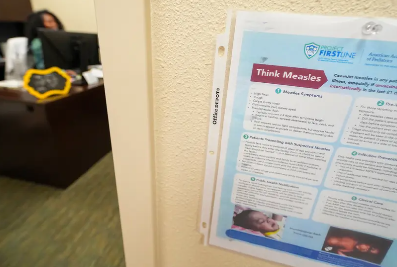 A sign with measles information is posted outside of the office of Dr. Rumbidzai Mutikani, a pediatrician at Hobbs Medical Clinic in Hobbs