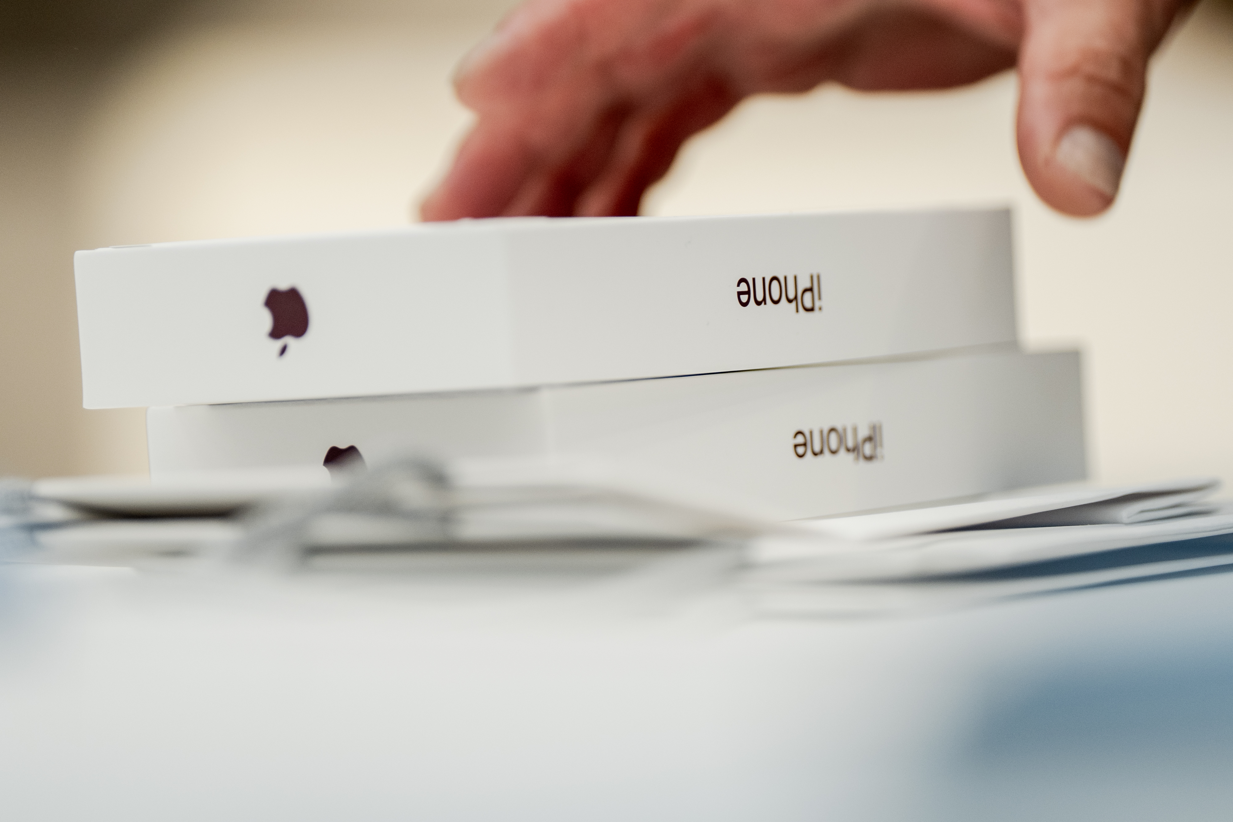 A customer buys newly-launched Apple iPhone 18 Pros at the Apple store on Fifth Avenue, Friday, Sept. 18, 2026, in New York. 