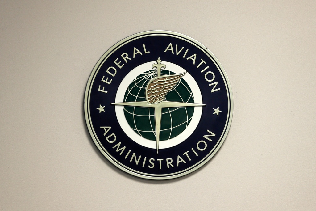 A Federal Aviation Administration sign hangs in the tower at John F. Kennedy International Airport in New York, March 16, 2017. 