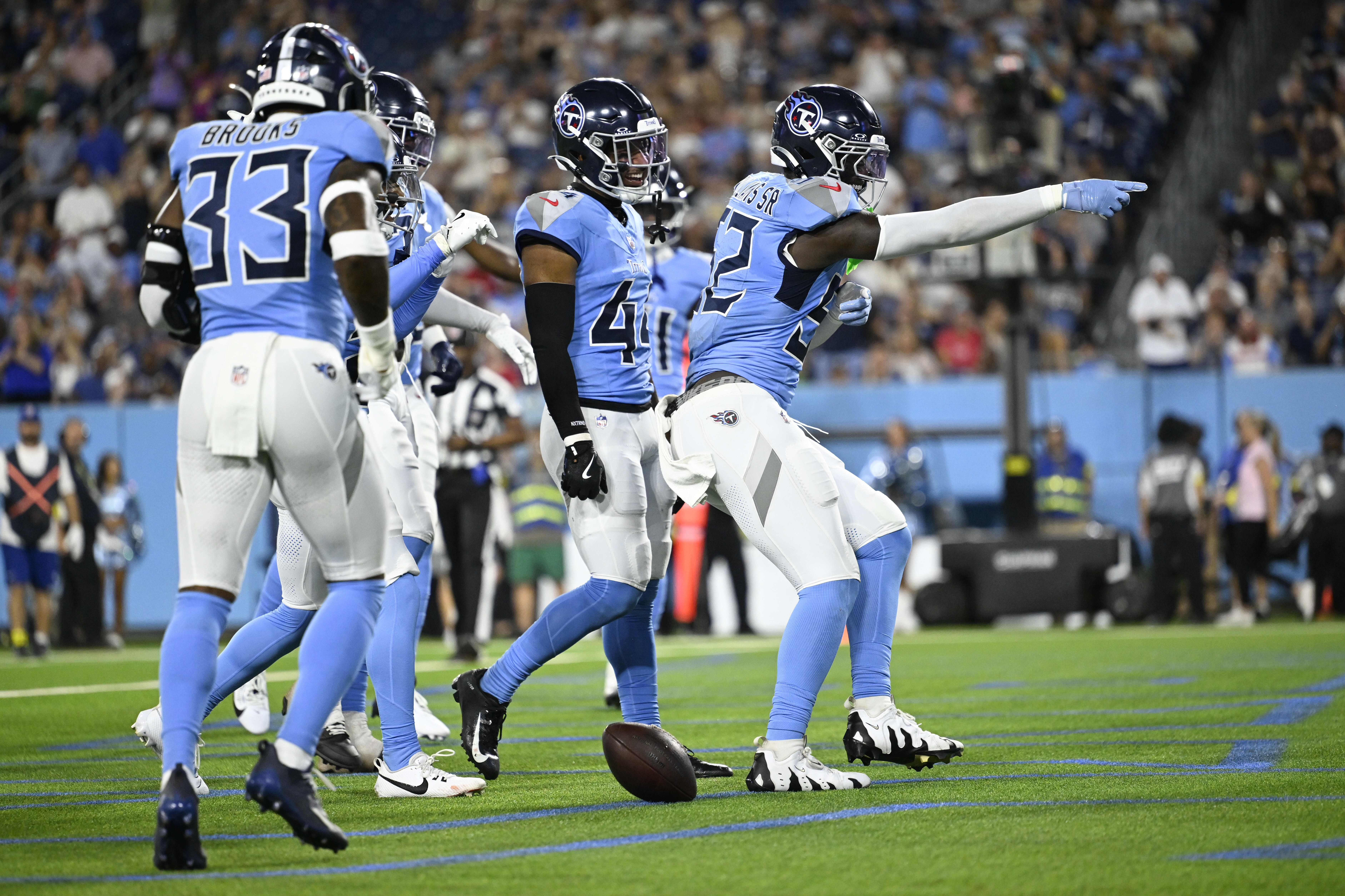 Tennessee Titans linebacker James Williams Sr. (52) celebrates after an interception against the Minnesota Vikings during the first half of a preseason NFL football game, Friday, Aug. 22, 2025, in Nashville, Tenn. 