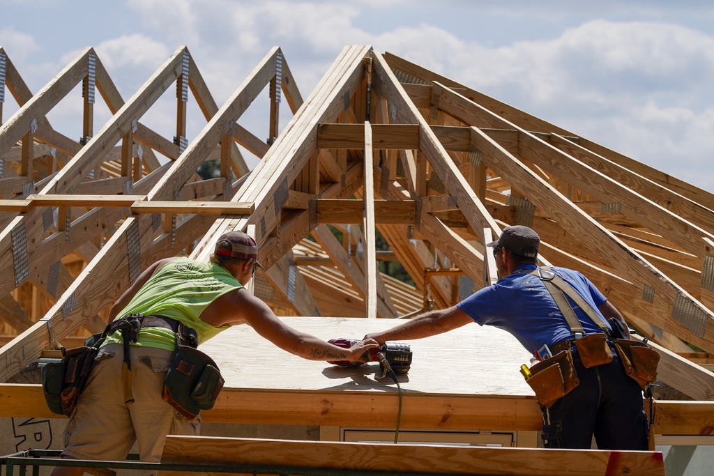 Carpenters work on a home on Sept. 19, 2023, in Marshall, N.C. 