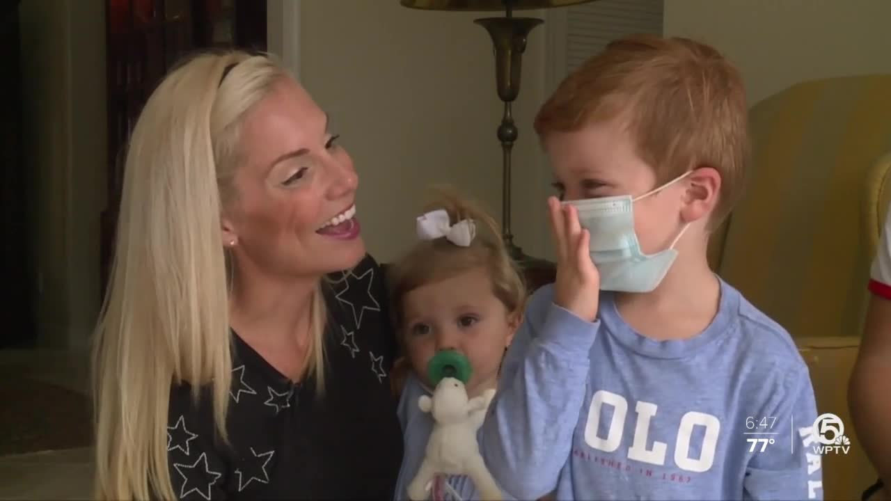 Ariel Bachman and son all smiles about wearing masks