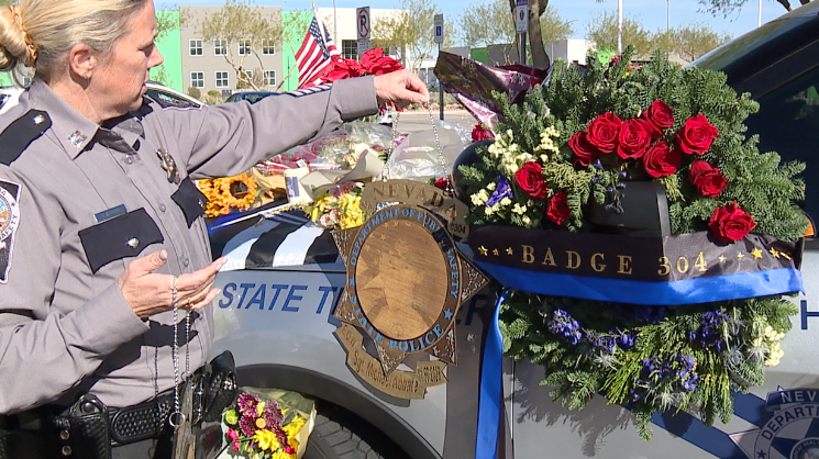 Patrol vehicle turns into memorial as community rallies for the families of two slain state troopers
