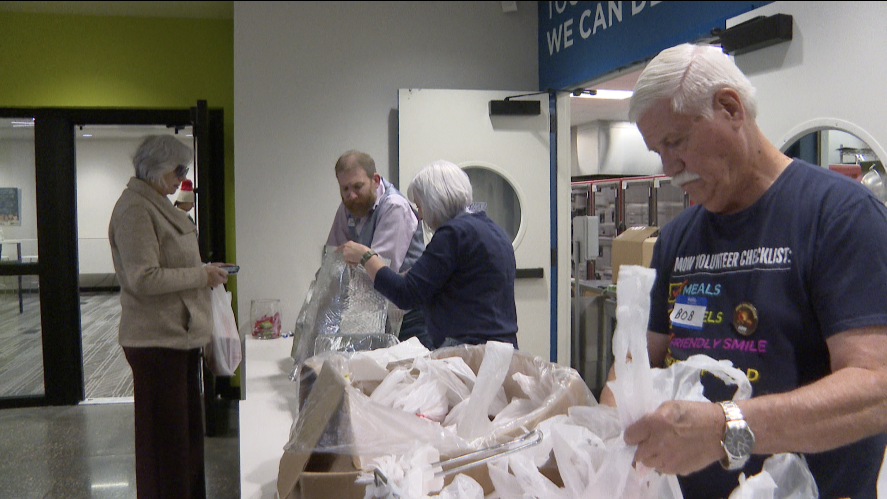 Meals on Wheels passing out food Thanksgiving 