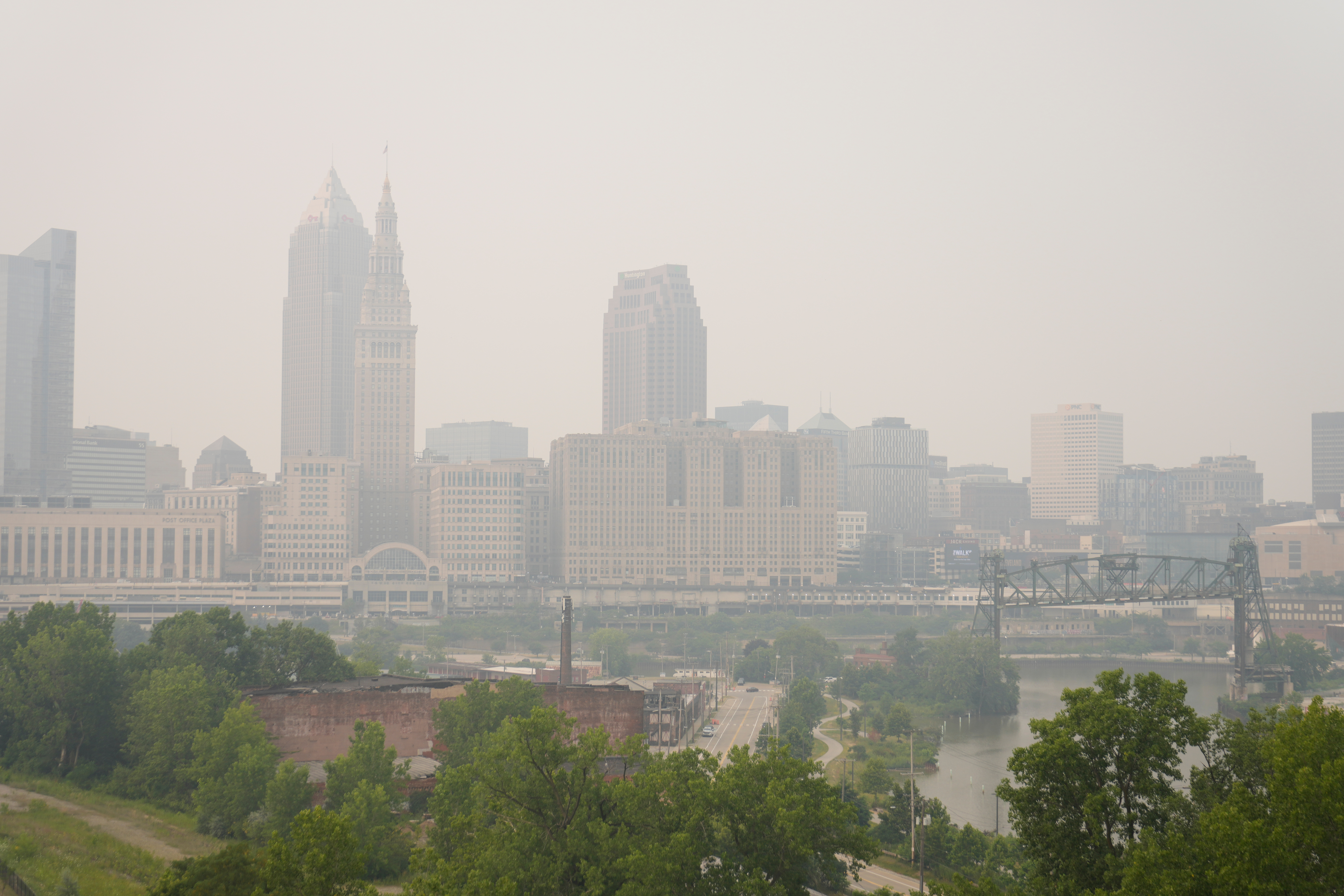 Smoke from Canadian wildfires blankets downtown Cleveland, forcing the postponement of a baseball game between the Pittsburgh Pirates and the Cleveland Guardians in Cleveland, Friday, July 17, 2026.