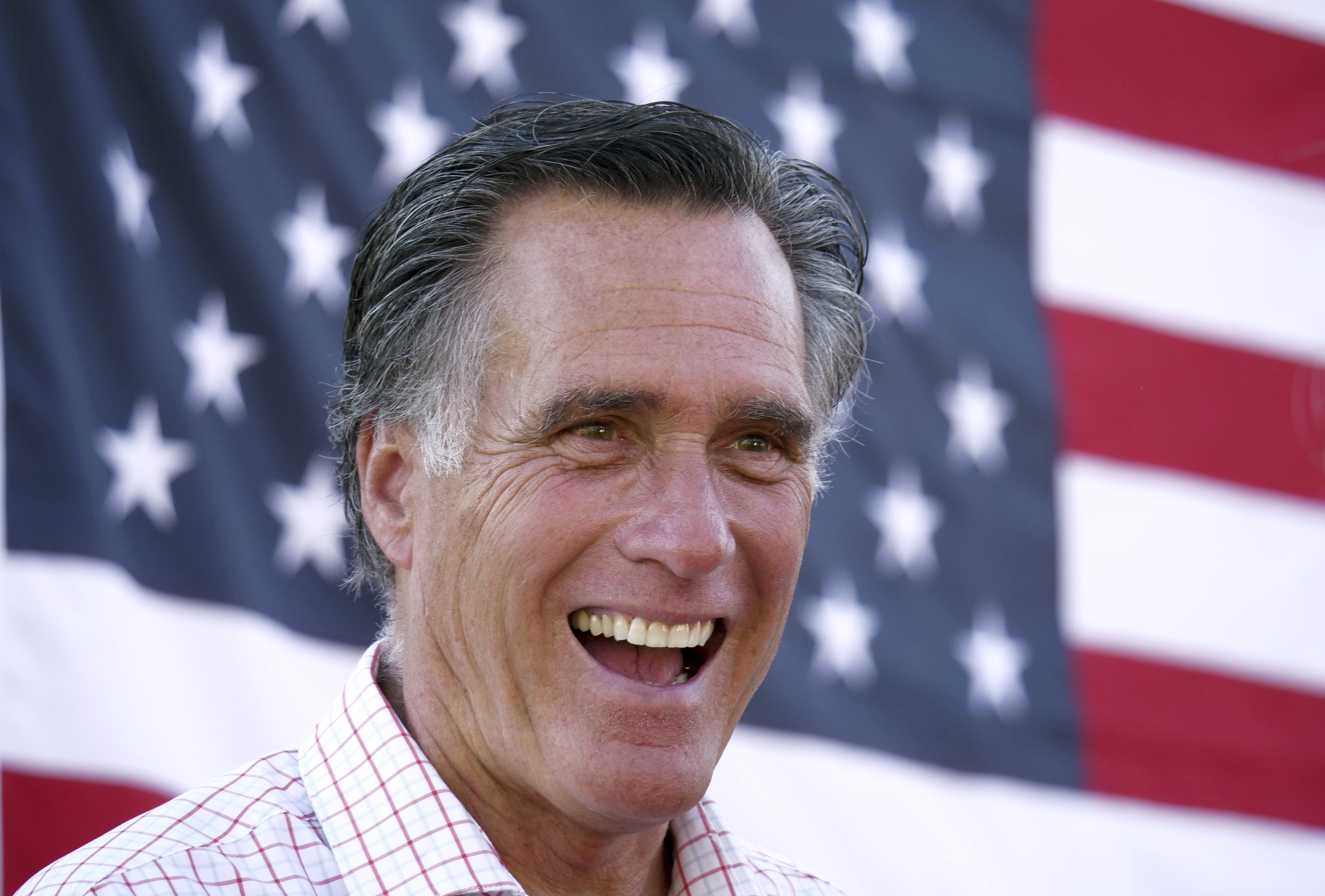 In this June 20, 2018, file photo, Mitt Romney smiles during a campaign event in American Fork, Utah.
