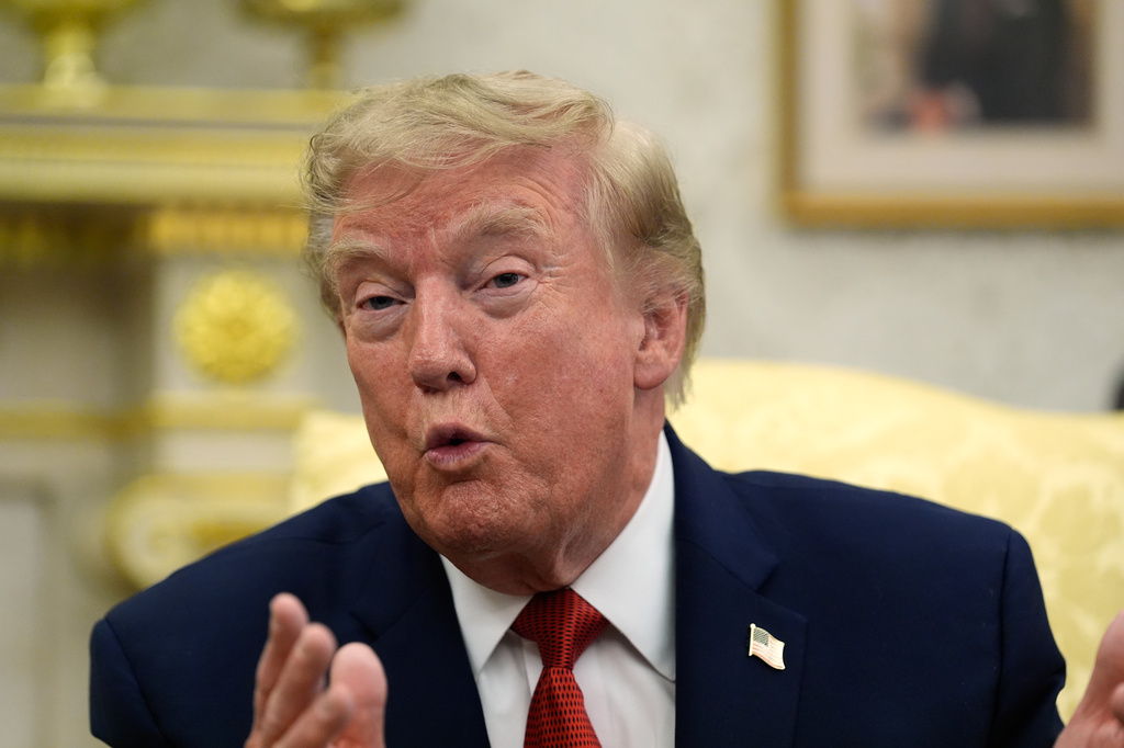 President Donald Trump speaks as he meets with lifeguard Ryder Williams in the Oval Office of the White House, Monday, Aug. 17, 2026, in Washington.