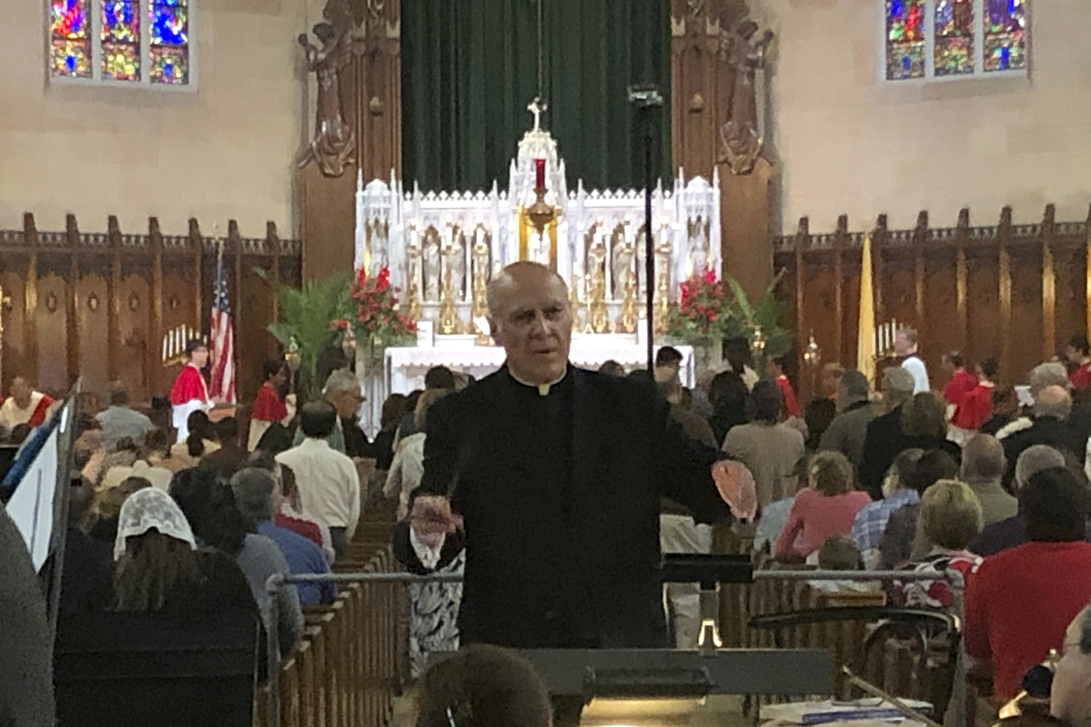 Detroit priest denies abuse, gets $125K in lawsuit deal