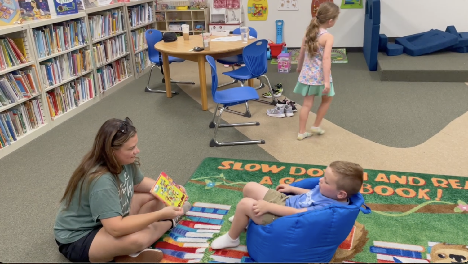 Library patron, Jessica Tucker, reads to her son