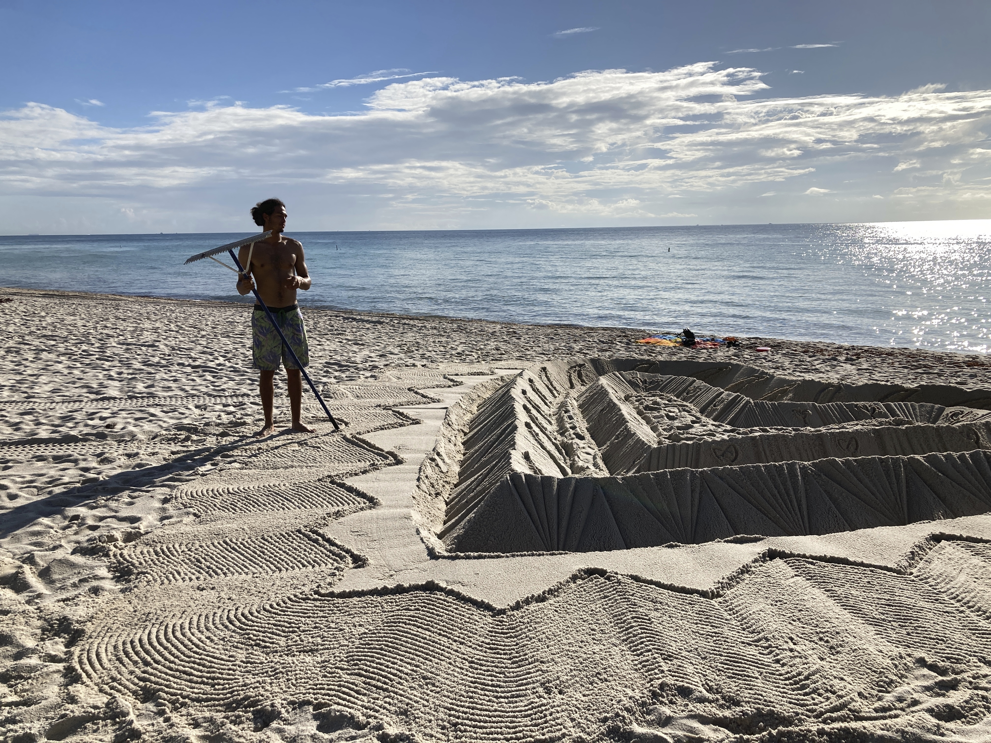 Sand sculptor hopes beach creation honors building victims