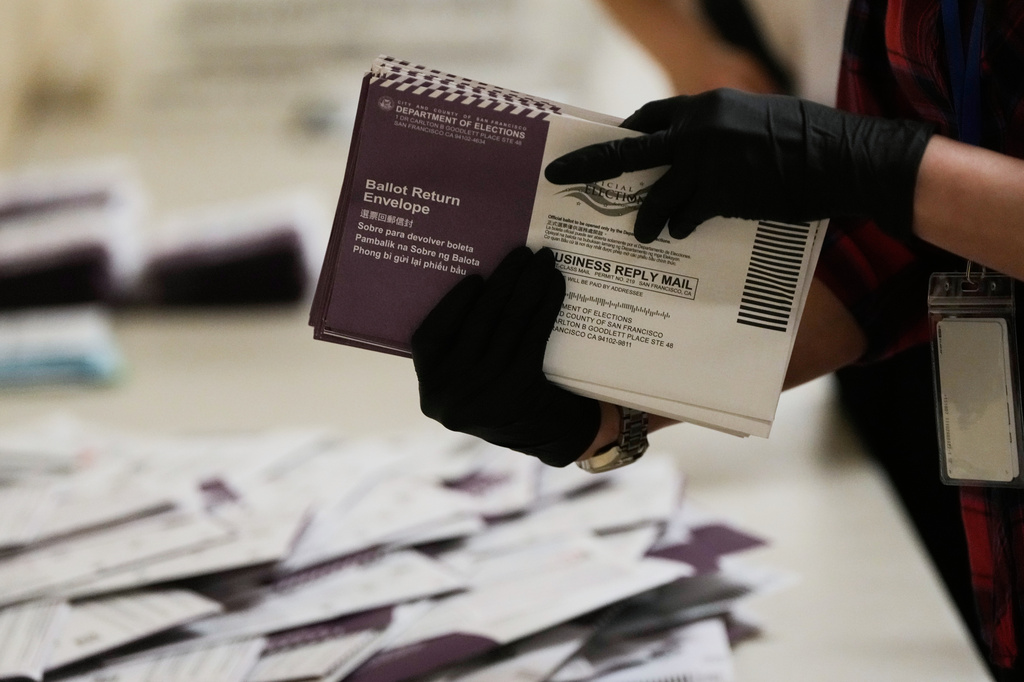 Department of Elections workers sort mail-in ballots for the California primary election at City Hall on Tuesday, June 2, 2026, in San Francisco. 