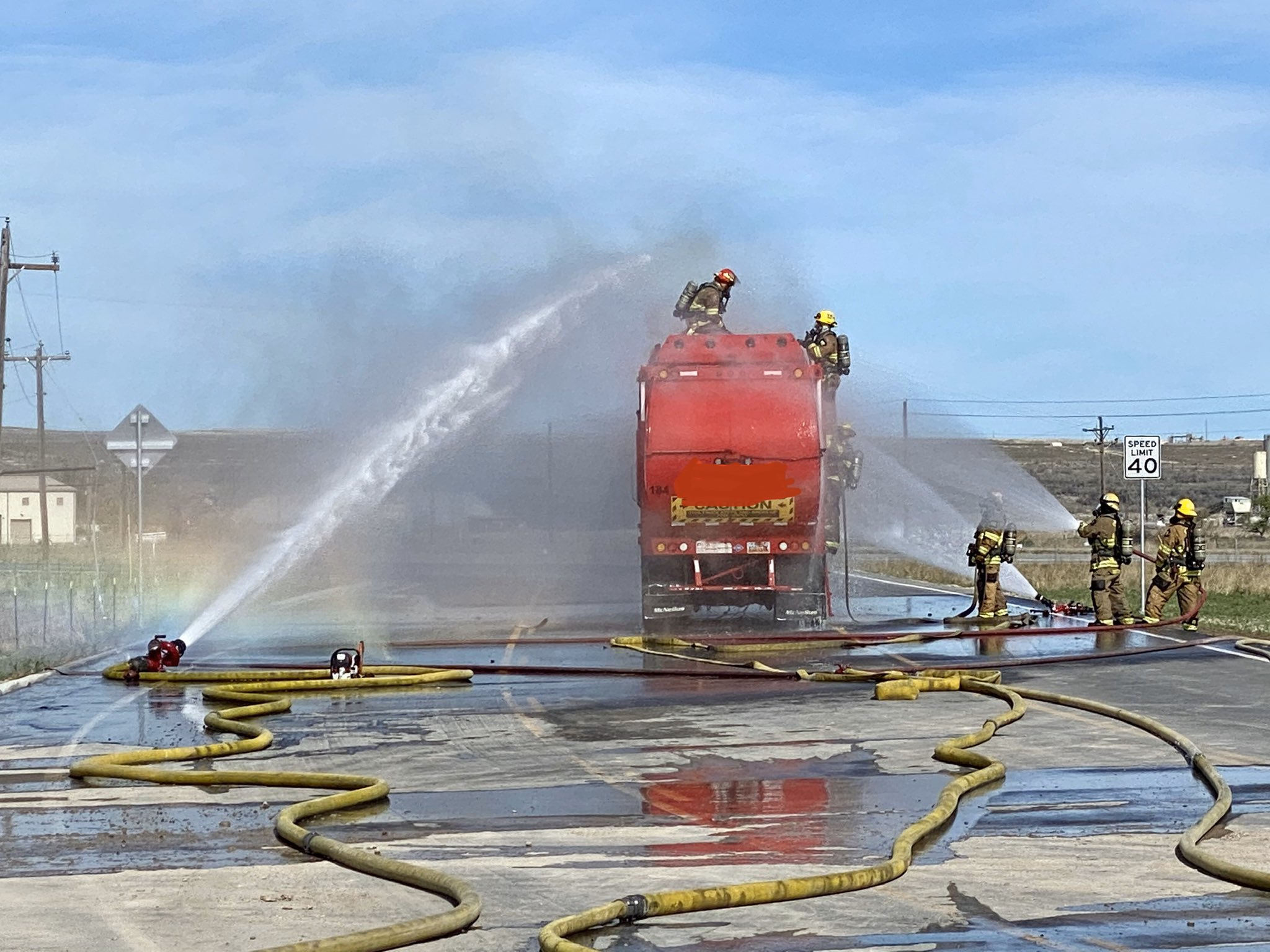 Unified Fire crews douse a fire on a garbage truck