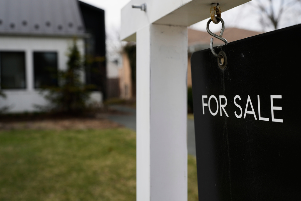 A House For Sale sign is displayed in front of a home.