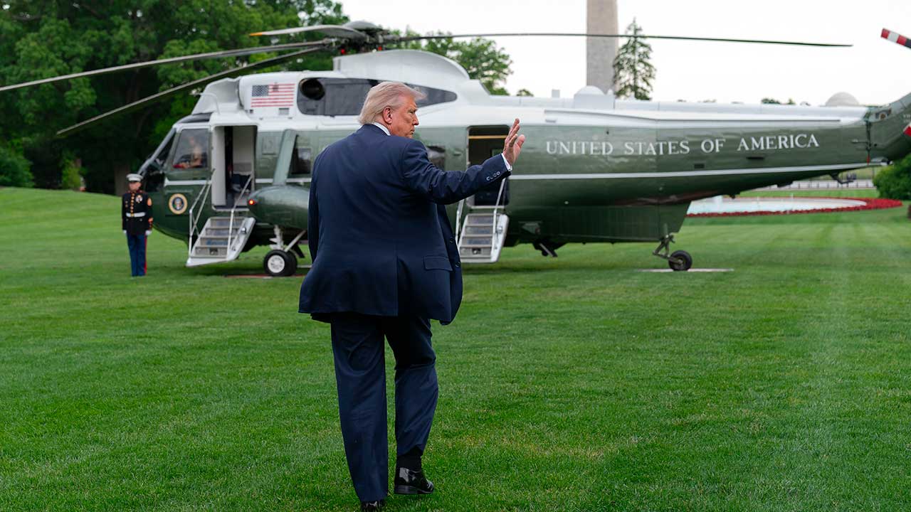 President Donald Trump waves to reporters as he walks to board Marine One on the South Lawn of the White House, Friday, May 8, 2026, in Washington.