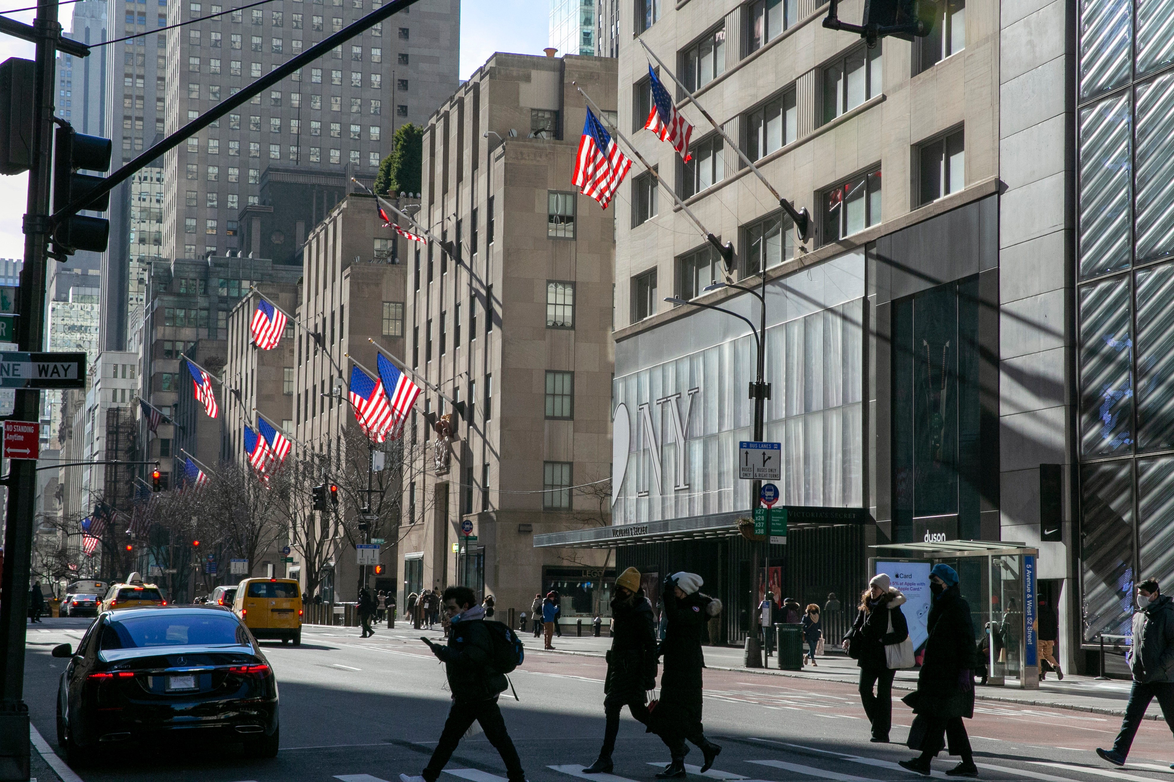 American flags wave in the wind on Fifth Avenue in the borough of Manhattan in New York City.