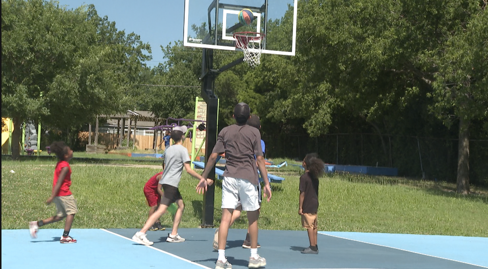 Youth playing basketball in Tulsa