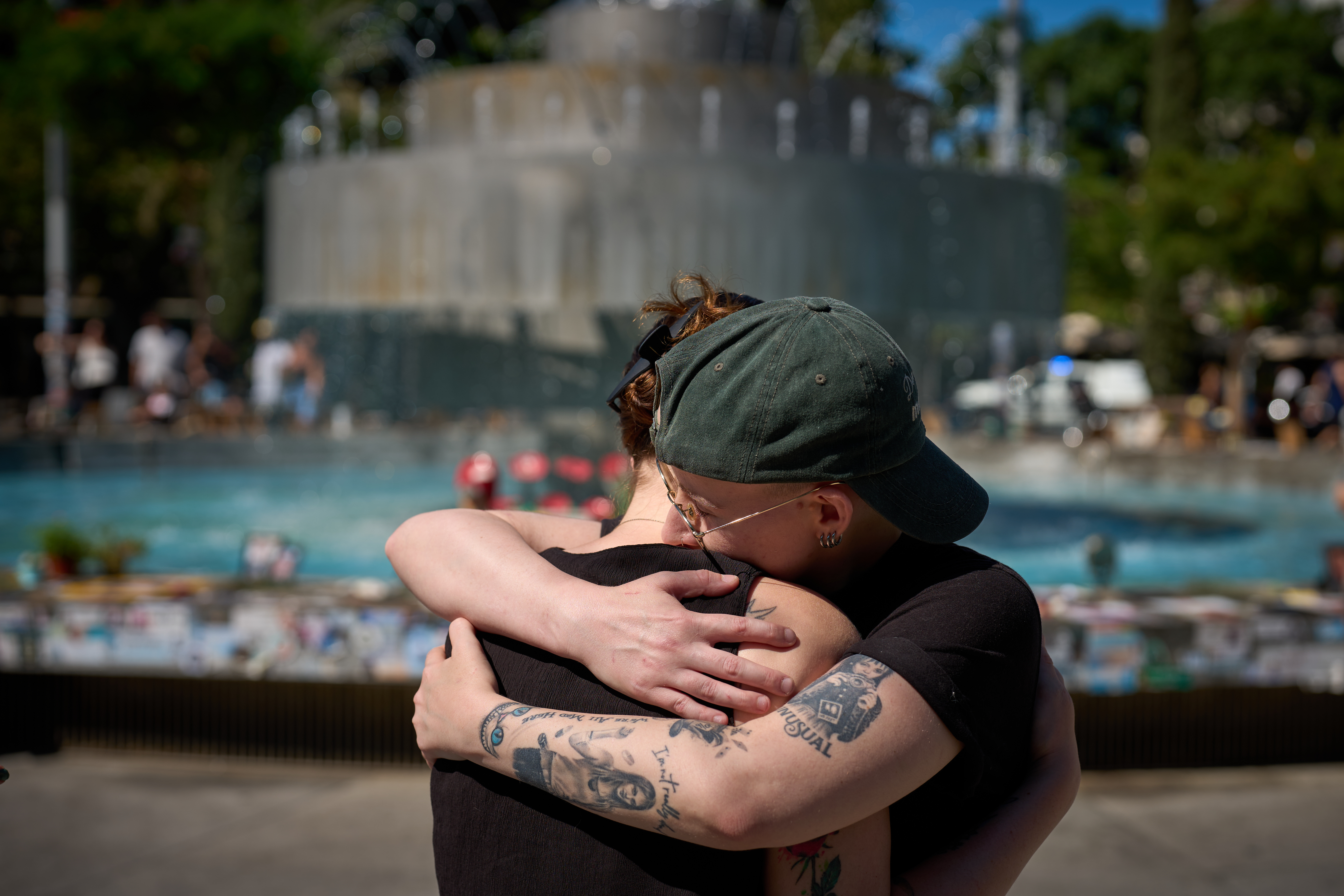 People embrace at a memorial marking two years anniversary of the Oct. 7, 2023 deadly Hamas attack on Israel, in Tel Aviv, Israel, Tuesday, Oct. 7, 2025. 