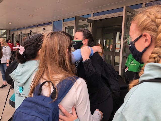 Tearful Coach Loveless hugs players