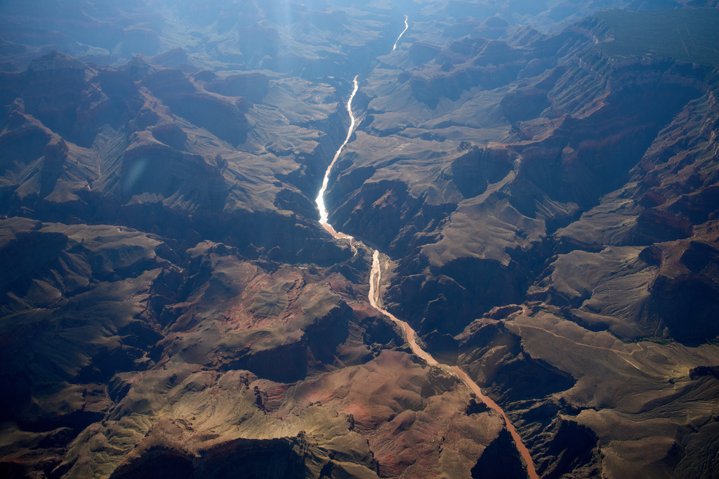 Bright Angel Canyon, middle left, the scene of flash floods, meets with the Colorado River in the Grand Canyon, Monday, Aug. 31, 2026, at Grand Canyon National Park, Ariz. 