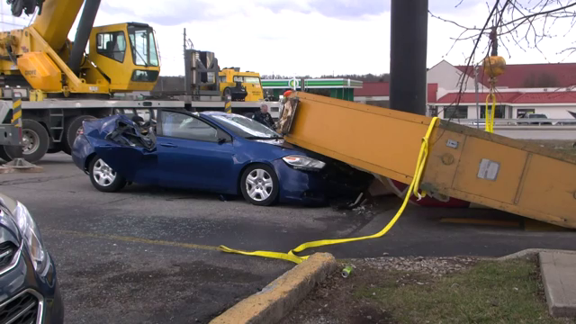 WOMAN DIES AFTER DENNY'S SIGN FALLS ON CAR